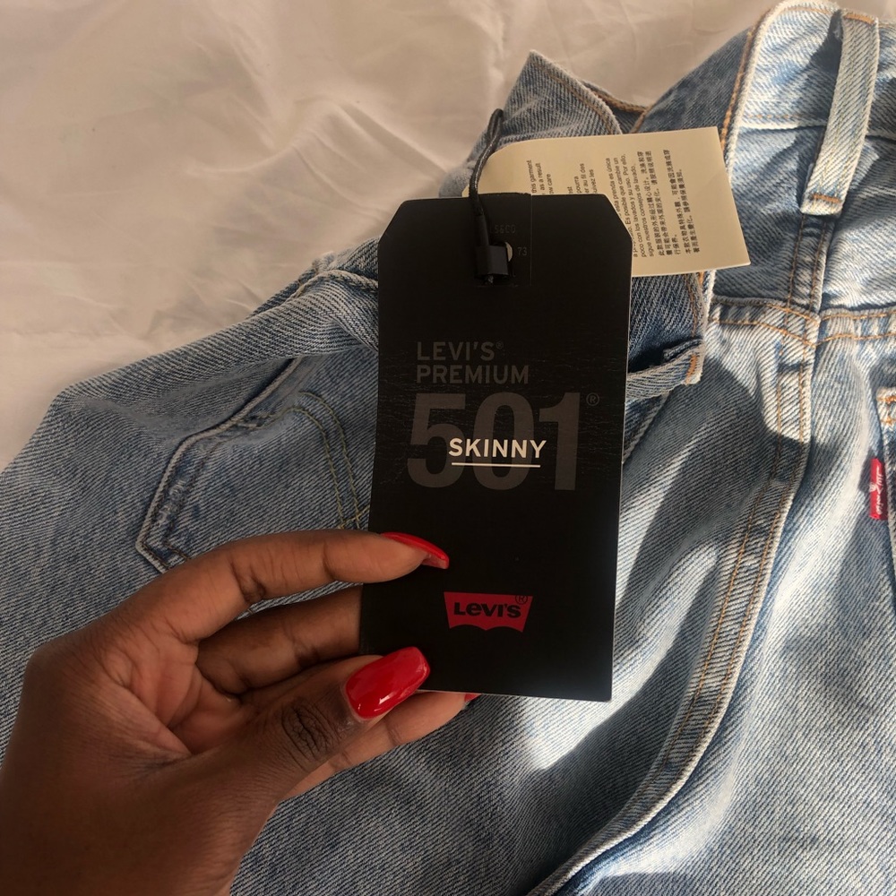 Levi skinny 501 jeans. Never worn. No rip.